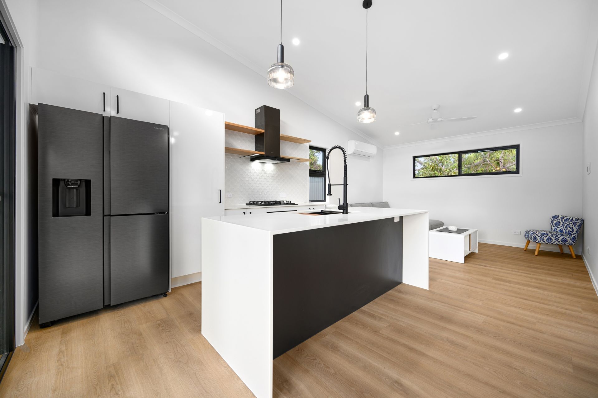 Modern open-plan kitchen and living inside a KiaDom small home